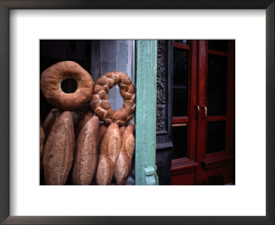 Bread Is Displayed In A Store Window by Raymond Gehman Pricing Limited Edition Print image