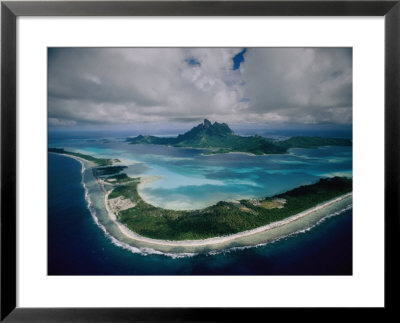 Aerial View Of Bora-Bora, Its White Beaches Ringed By A Coral Reef by Jodi Cobb Pricing Limited Edition Print image