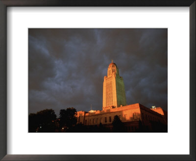 A Storm Brews Over The Nebraska State Capitol In Lincoln by Joel Sartore Pricing Limited Edition Print image