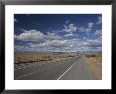 A Scenic Of Route 40 Passing Through An Arizona Desert by Roy Gumpel Pricing Limited Edition Print image