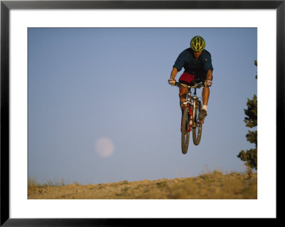 A Man Catches Some Air On His Mountain Bike by Bobby Model Pricing Limited Edition Print image
