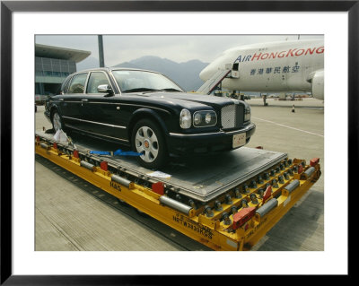 Luxury Bentley Unloaded From An Airplane At Chek Lap Kok Airport by Eightfish Pricing Limited Edition Print image