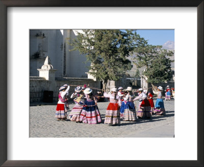 Girls In Traditional Local Dress Dancing In Square At Yanque Village, Colca Canyon, Peru by Tony Waltham Pricing Limited Edition Print image