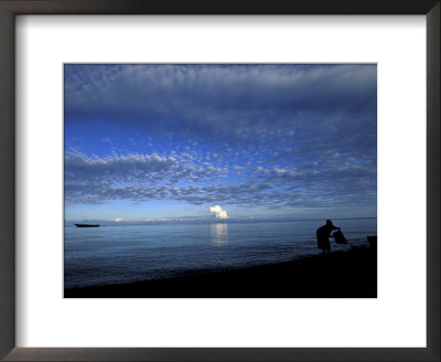 Silhouetted Woman On Lake Tanganyika, Tanzania by Kristin Mosher Pricing Limited Edition Print image