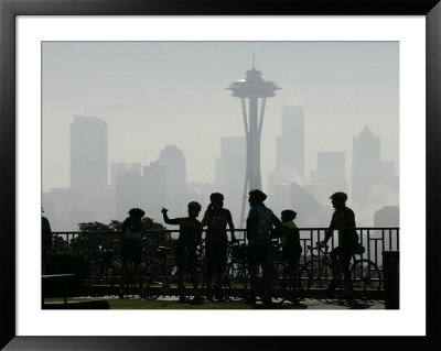 Members Of The Cascade Bike Club Pause And Take In A Foggy View Of The Space Needle by Ted S. Warren Pricing Limited Edition Print image