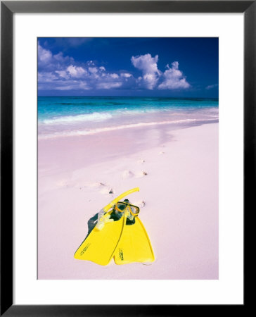 Yellow Mask And Fins On Pink Sand Beach Of Harbour Island, Bahamas by Greg Johnston Pricing Limited Edition Print image