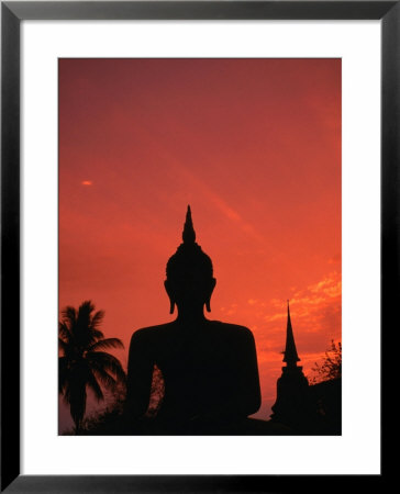Buddha Against A Sunset At Wat Mahathat, Sukhothai, Thailand by Anders Blomqvist Pricing Limited Edition Print image