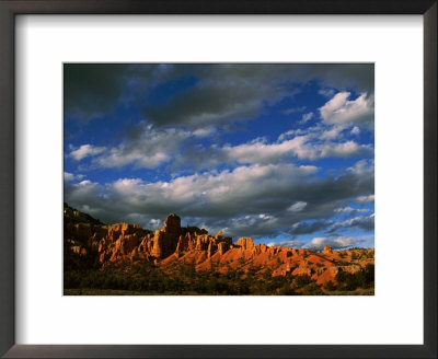 Warm Sunlight Washes Over The Landscape Of Cliffs In Utah by Barry Tessman Pricing Limited Edition Print image