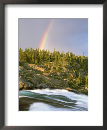 The Mist-Filled Tides Of Clearwater River Wash Against A Rocky Shore Where A Ra Inbow Takes Form by Barry Tessman Pricing Limited Edition Print image