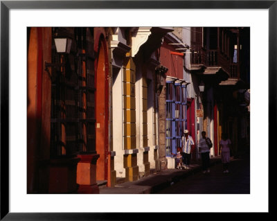 Children Walking Past Colonial Facades On Cartagena De Indias, Cartagena, Colombia by Alfredo Maiquez Pricing Limited Edition Print image