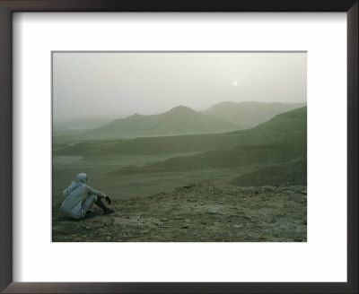 A Man Stares Out At The Desert Landscape by W. Robert Moore Pricing Limited Edition Print image