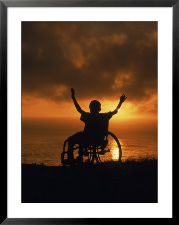 Silhouetted Boy In Wheelchair At Sunset by David Richardson Pricing Limited Edition Print image