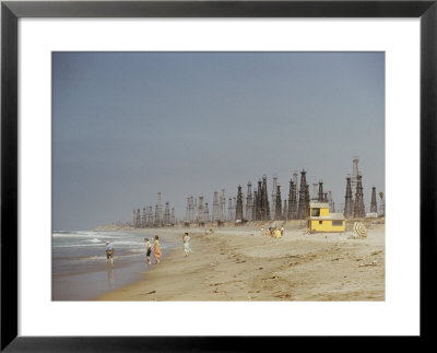 Beach Scene With Oil Rigs In The Background by Joseph Baylor Roberts Pricing Limited Edition Print image