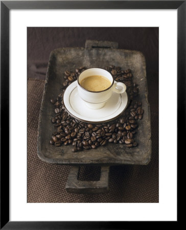 A Cup Of Espresso On A Wooden Bowl With Coffee Beans by Anita Oberhauser Pricing Limited Edition Print image