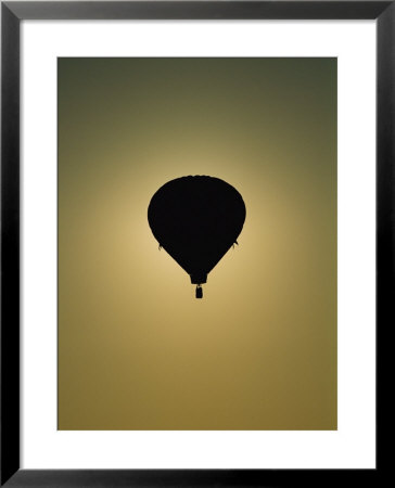 Silhouetted Hot-Air Balloon In Flight by Brian Gordon Green Pricing Limited Edition Print image