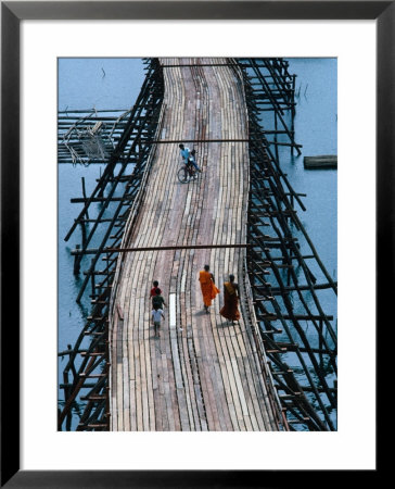 People Walking On Wooden Bridge Joining Hilltribe Villages To Mainland, Kanchanaburi, Thailand by Bill Wassman Pricing Limited Edition Print image