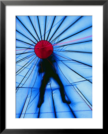 The Figure Of A Person Is Silhouetted Atop A Hot-Air Balloon by Monika Klum Pricing Limited Edition Print image