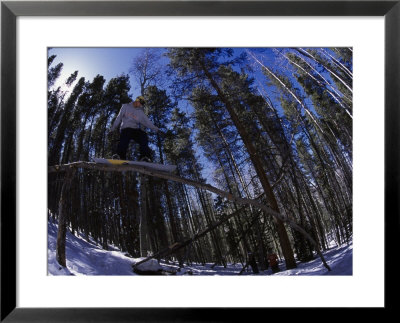 Man Riding Log On Snowboard, Vail, Co by Kurt Olesek Pricing Limited Edition Print image