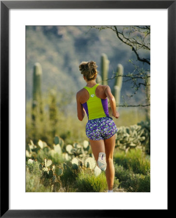 A Woman Runs Through The Desert Landscape by Dugald Bremner Pricing Limited Edition Print image