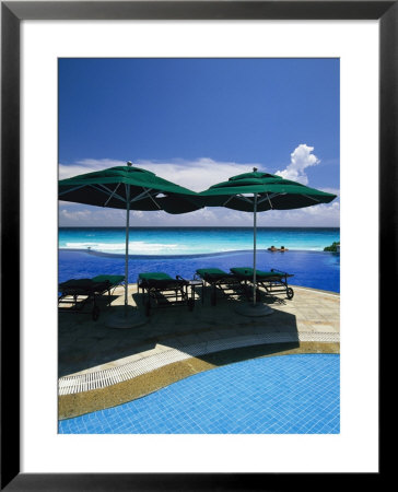 A Swimming Pool Overlooks The Caribbean Sea At A Resort In Cancun by Michael Melford Pricing Limited Edition Print image