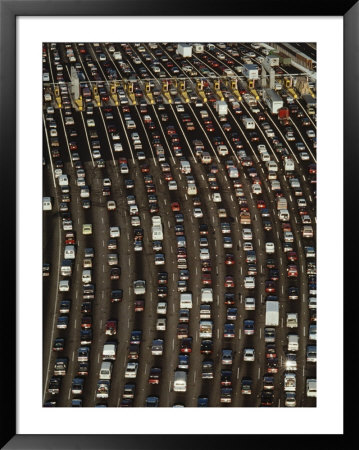 Cars Queue Up At A Tollbooth On The Bay Bridge In Oakland, California, During Rush Hour by Jim Sugar Pricing Limited Edition Print image