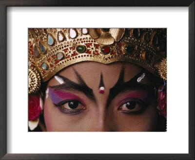 A Close View Of A Face Of A Balinese Dancer In Costume And Makeup by Paul Chesley Pricing Limited Edition Print image