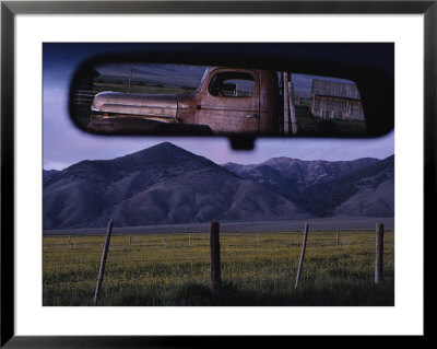 An Old Truck And Barn Are Reflected In A Rear-View Mirror by Joel Sartore Pricing Limited Edition Print image