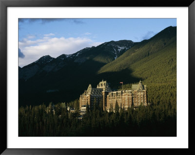 The Banff Springs Hotel, Nestled In An Evergreen Forest by Michael S. Lewis Pricing Limited Edition Print image