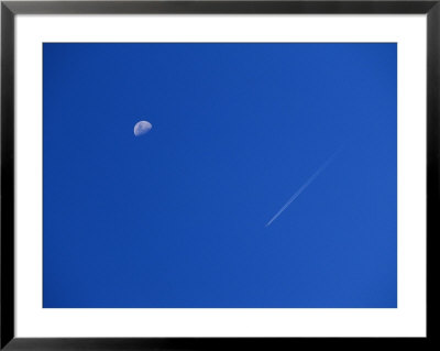 View Of The Sky With The Moon And A Vapor Trail From A Passing Jet by Marc Moritsch Pricing Limited Edition Print image