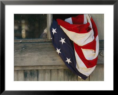 An American Flag Draped Through An Open Barn Window by Raul Touzon Pricing Limited Edition Print image