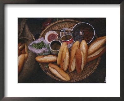 Loaves Of Bread And Various Sauces Arranged On A Small Table by Steve Raymer Pricing Limited Edition Print image