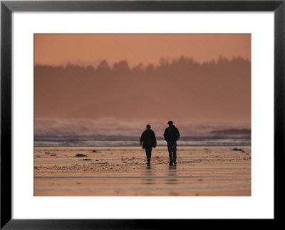 Two People Walk Along The Tidal Flats Of Clayoquot Sound by Joel Sartore Pricing Limited Edition Print image