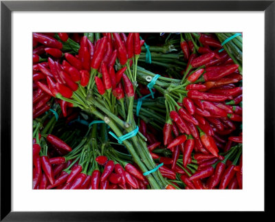 Red Chile Peppers In Bunches At The Rialto Market In Venice, Italy by Todd Gipstein Pricing Limited Edition Print image