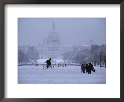 Snow Blankets The Mall And The Capitol Building Amid Winter Activity by Stephen St. John Pricing Limited Edition Print image
