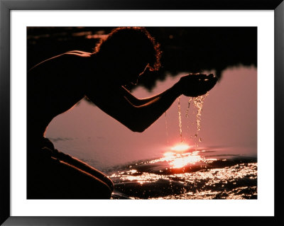 A Person Dips His Hands In The Headwaters Of The Mississippi River by Sam Kittner Pricing Limited Edition Print image