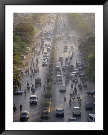 Cars And Mopeds Fill The Main Thoroughfare Through Saigon by Paul Chesley Pricing Limited Edition Print image