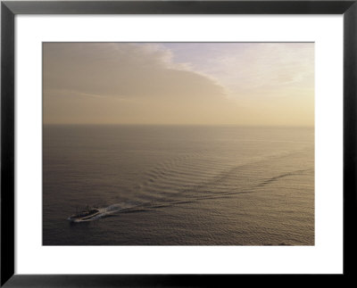 A Ship Crosses The Ocean At Sagres, Portugal by Stephen Alvarez Pricing Limited Edition Print image