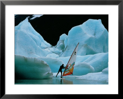 Windsurfer Practices His Sport Alongside Icebergs by Chris Johns Pricing Limited Edition Print image