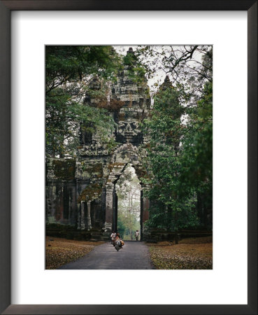 Visitors Enter The Angkor Wat Complex Through A Magnificent Gate by Steve Raymer Pricing Limited Edition Print image