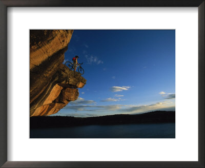 A Cyclist Atop A Rock Overhang Near Dolores, Colorado by Bill Hatcher Pricing Limited Edition Print image