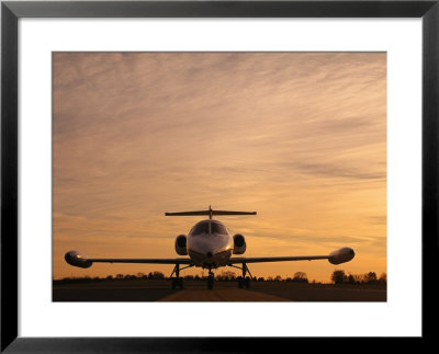 Twilight View Of A Lear Jet On The Runway by Kenneth Garrett Pricing Limited Edition Print image