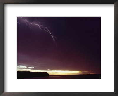 A Bolt Of Lightning Crosses A Stormy Sky by Bill Curtsinger Pricing Limited Edition Print image
