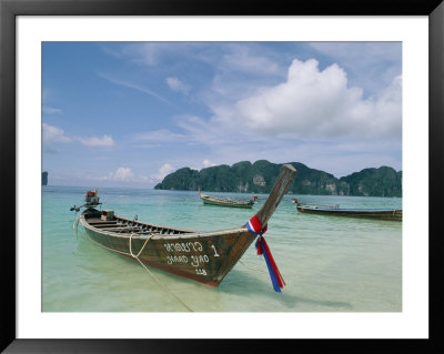 Beautifully Crafted Canoes Await Passengers At Ko Pi Pi Beach by Barry Tessman Pricing Limited Edition Print image