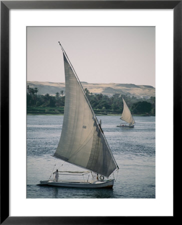 Twin Feluccas Move In Unison On The Nile Near Luxor by Stephen St. John Pricing Limited Edition Print image