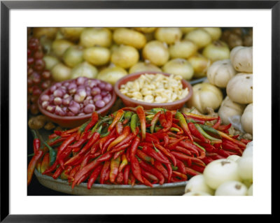 Close View Of Chili Peppers And Other Vegetables At A Food Market by Steve Raymer Pricing Limited Edition Print image