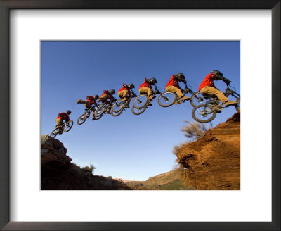 Mountain Biker Catches Air At Rampage Site Near Virgin, Utah, Usa by Chuck Haney Pricing Limited Edition Print image