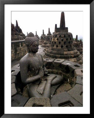 A Statue Of Buddha Sits On A Terrace by Dita Alangkara Pricing Limited Edition Print image