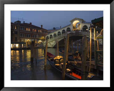 Grand Canal, Rialto Bridge At Night, Gondolas On Waterfront, Venice, Veneto, Italy by Christian Kober Pricing Limited Edition Print image