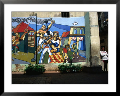 Woman Leaning Against A Wall With Mural In Old Havana, Havana, Cuba by Rick Gerharter Pricing Limited Edition Print image