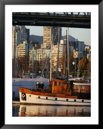 Classic Boat Under Granville Street Bridge, Vancouver, Canada by Lawrence Worcester Pricing Limited Edition Print image
